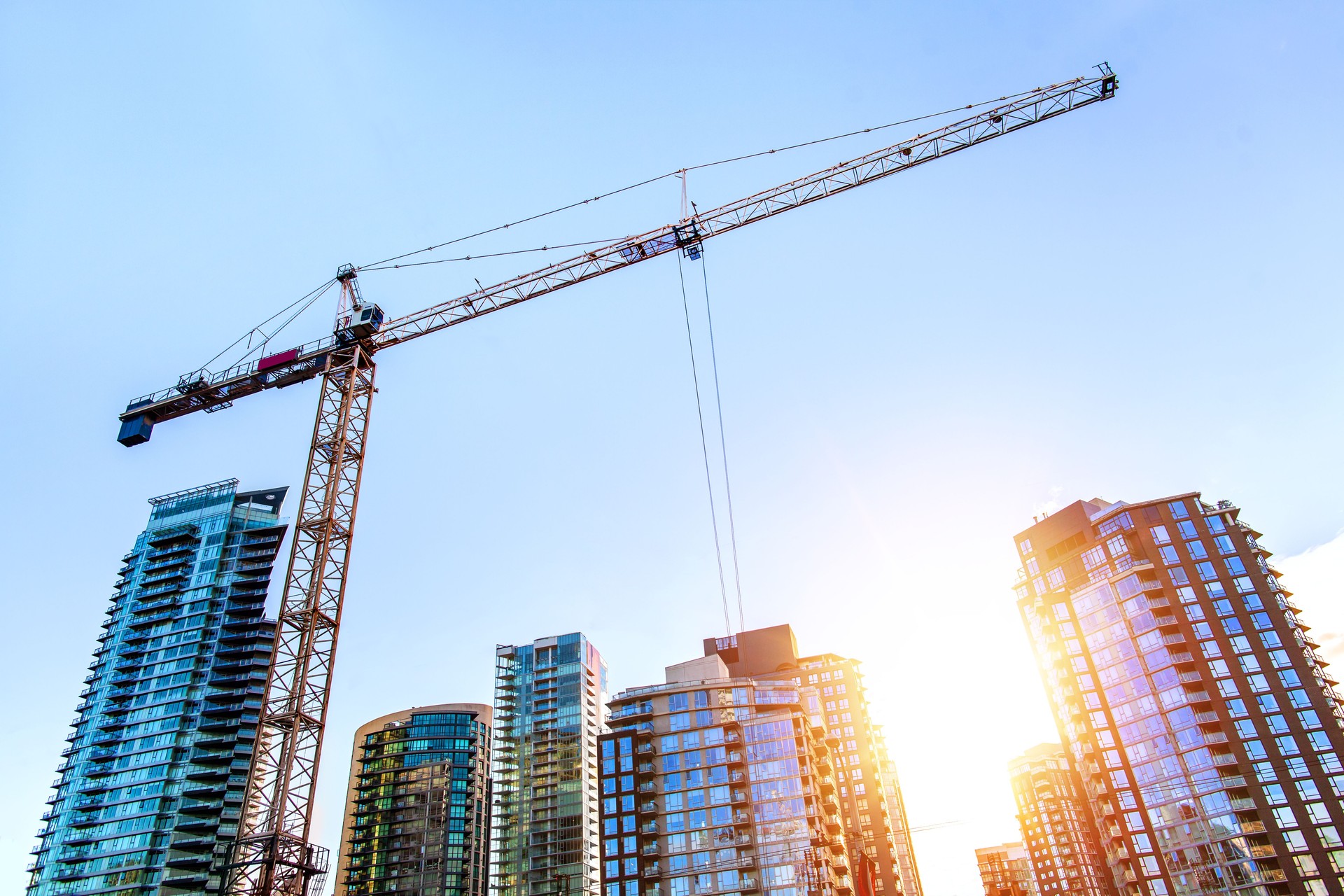 Construction crane in downtown Vancouver at sunrise